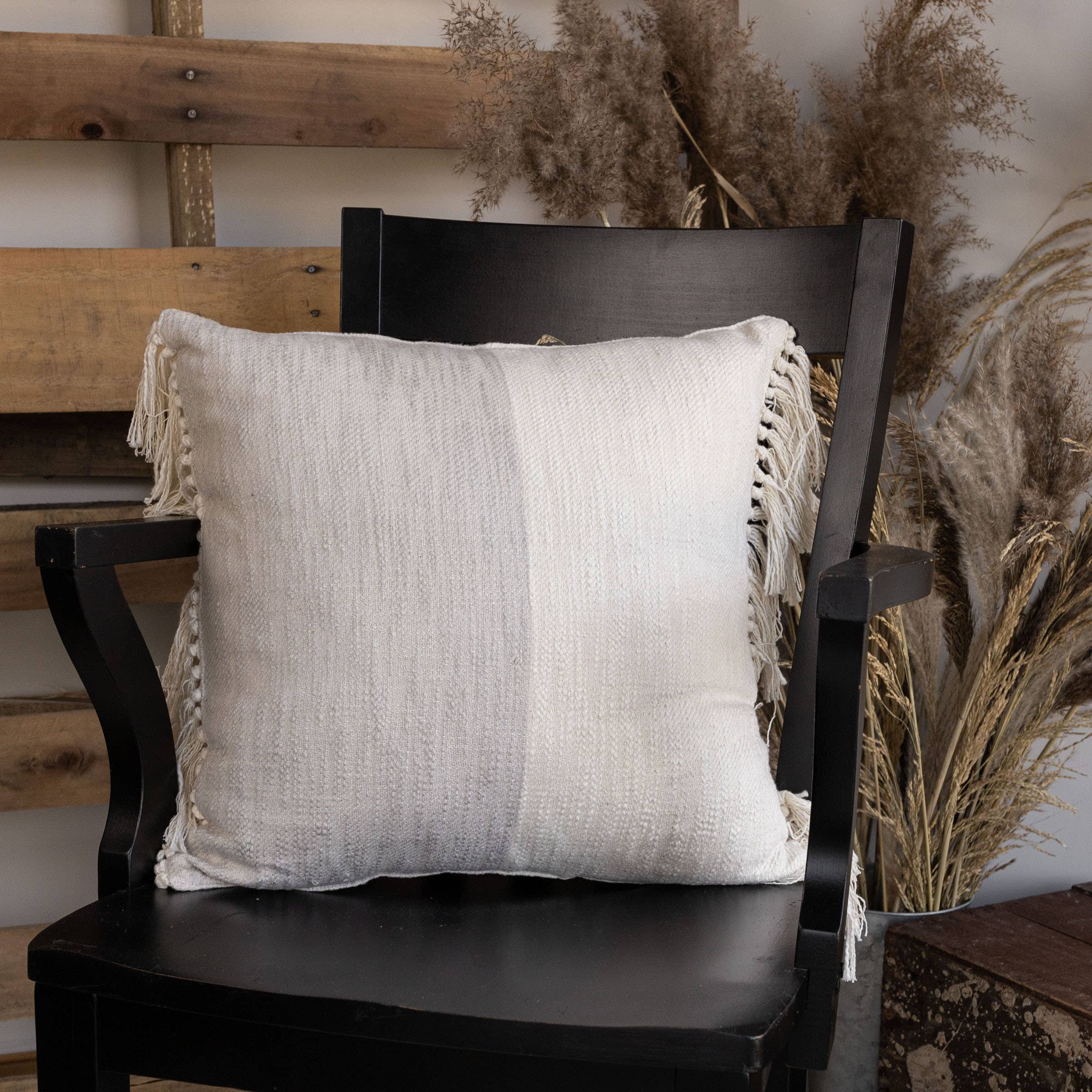 boo and rook grey and white color block woven boho pillow with fringe detail