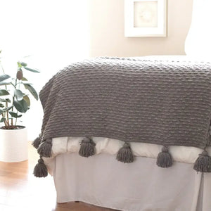 boucle woven blanket with tassels